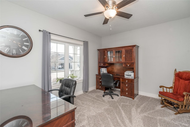 office with light carpet, baseboards, and ceiling fan