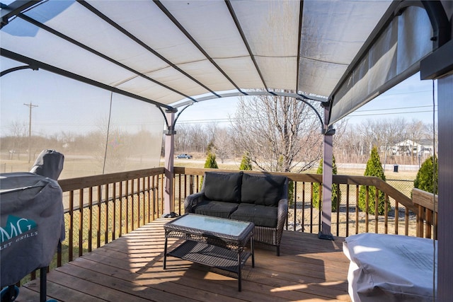 wooden deck with a grill and outdoor lounge area