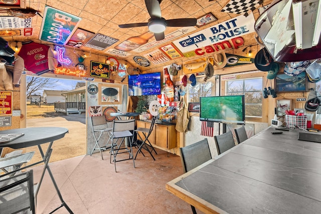 interior space featuring concrete flooring and a ceiling fan