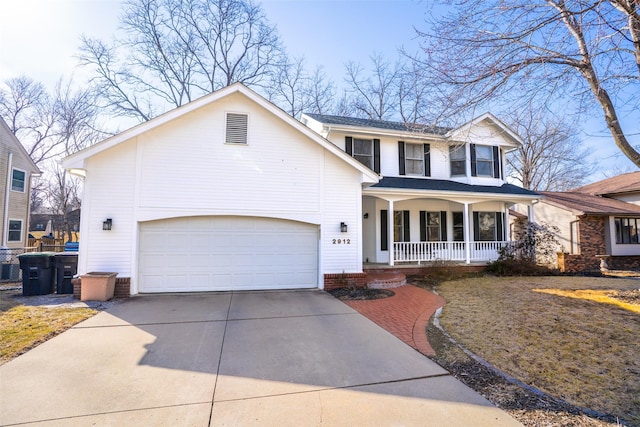 traditional-style house with a garage, a porch, and driveway