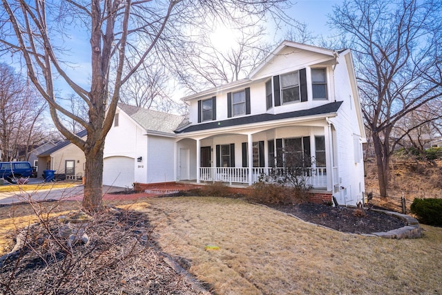 view of front of house with a porch and a garage