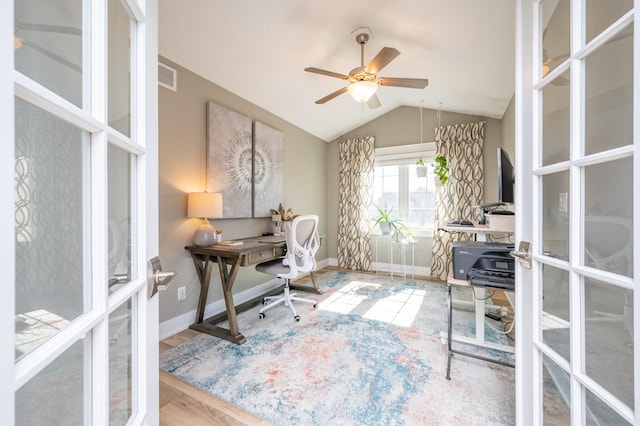 office featuring vaulted ceiling, wood finished floors, a ceiling fan, and baseboards