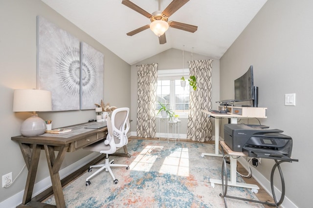 home office with vaulted ceiling, a ceiling fan, and baseboards