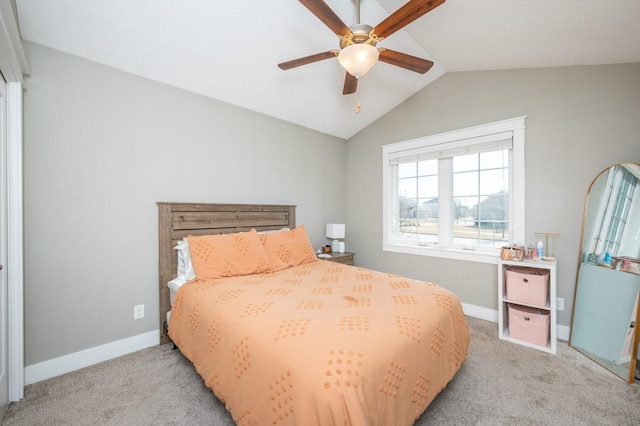 bedroom with baseboards, lofted ceiling, and light colored carpet