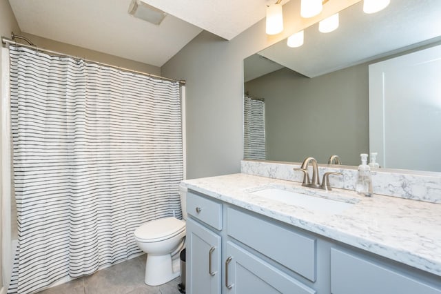 full bathroom with tile patterned floors, toilet, and vanity