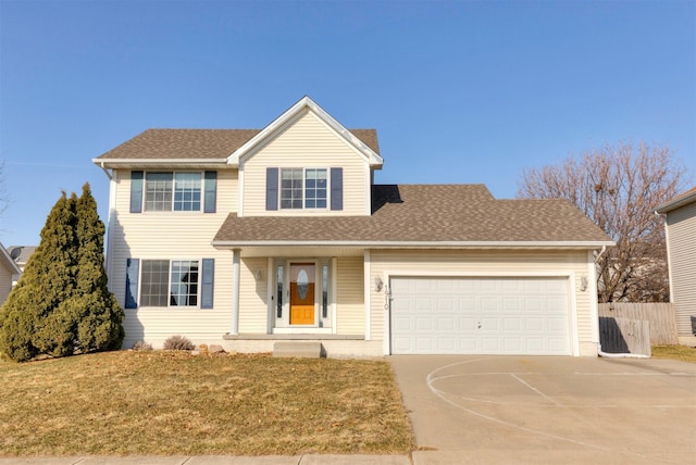 view of front of house featuring fence, driveway, roof with shingles, a front lawn, and a garage