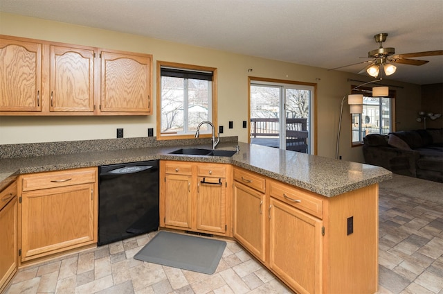 kitchen featuring a sink, open floor plan, a peninsula, dishwasher, and ceiling fan