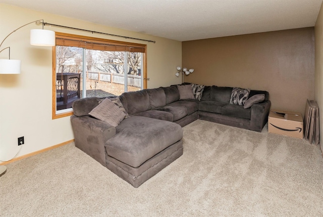 carpeted living room with baseboards