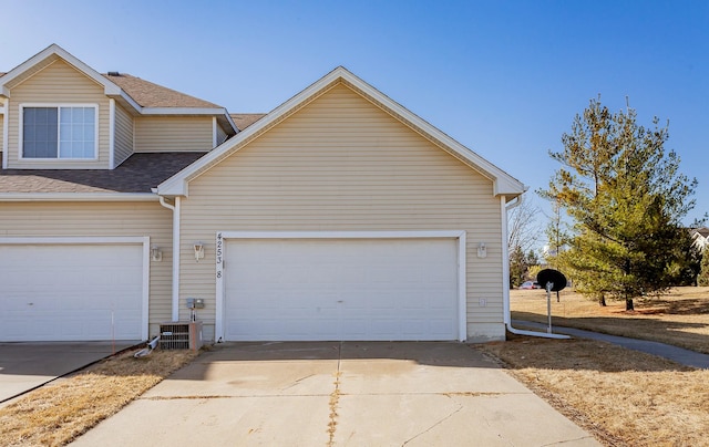 garage with concrete driveway