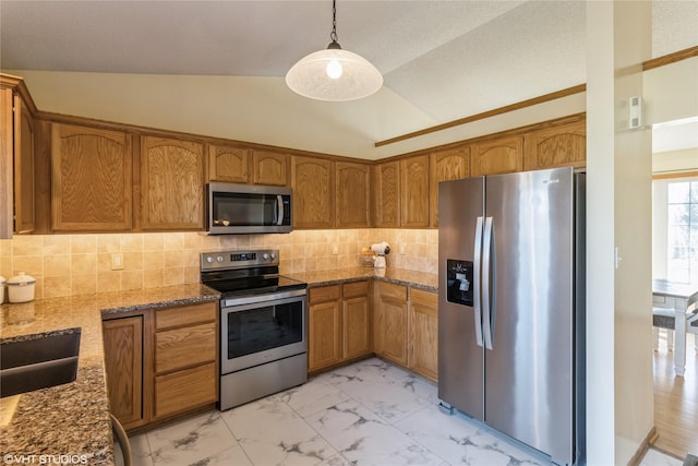 kitchen with vaulted ceiling, brown cabinets, marble finish floor, and stainless steel appliances