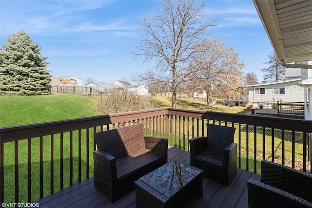 wooden deck with a yard and fence