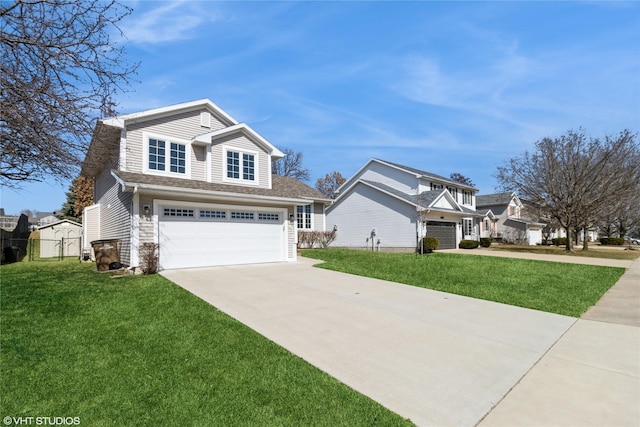 view of front of house featuring a front yard, concrete driveway, and an attached garage