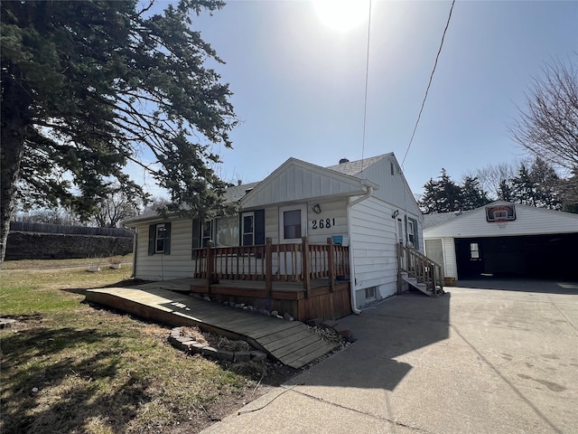 view of front of house with a wooden deck and board and batten siding