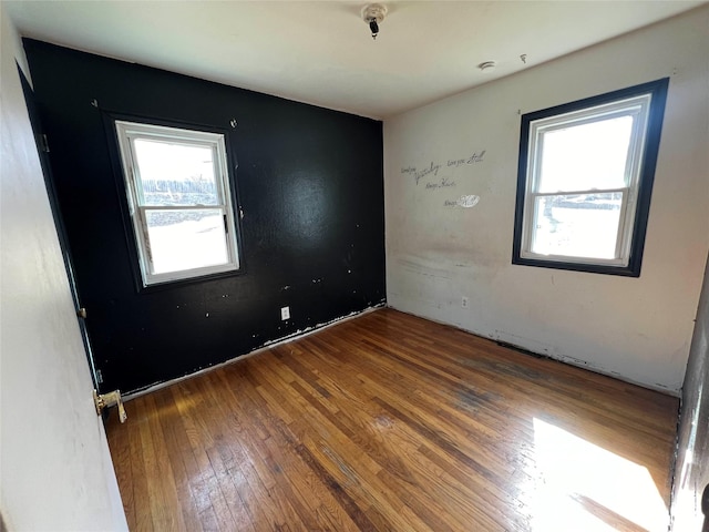 empty room featuring hardwood / wood-style flooring