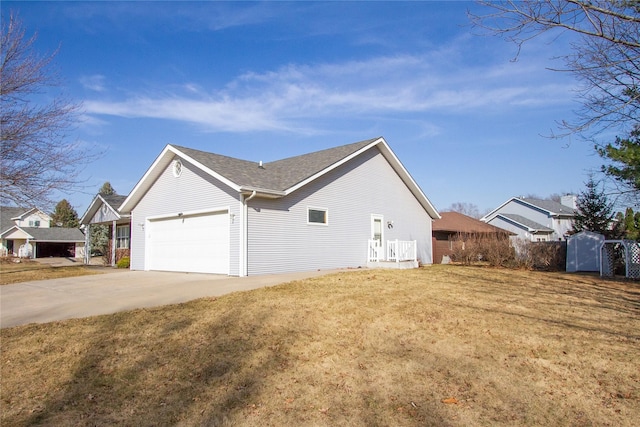 view of property exterior with a lawn, a garage, and driveway