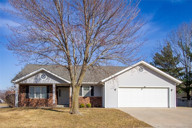 single story home featuring brick siding, driveway, an attached garage, and a front yard