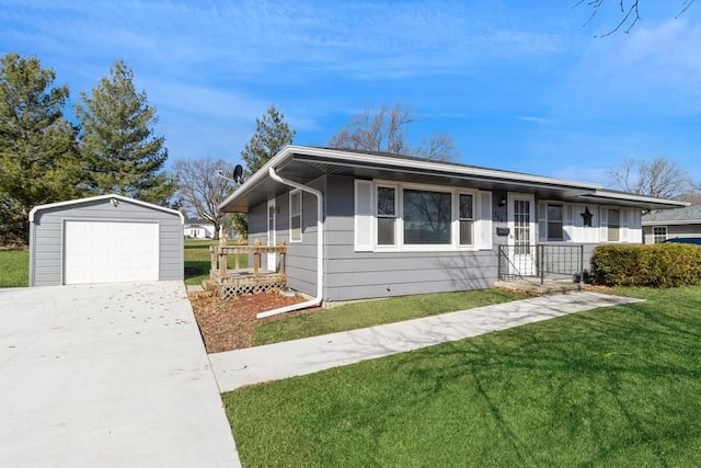 view of front of property featuring an outdoor structure, a detached garage, a front yard, and driveway