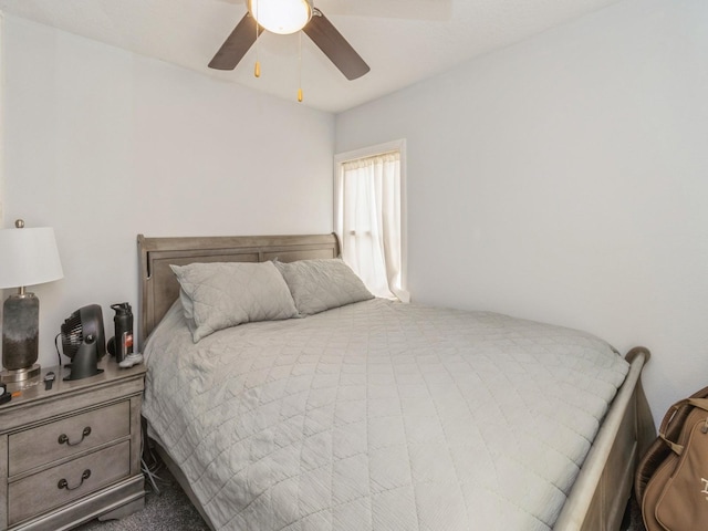 bedroom with ceiling fan and carpet floors