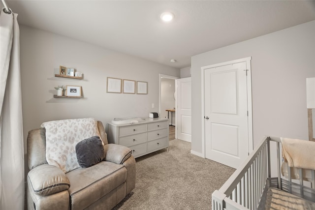 bedroom featuring light colored carpet