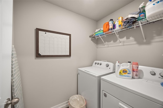 laundry room featuring washing machine and dryer and laundry area