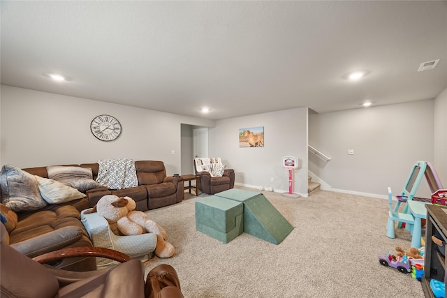 living area with visible vents, recessed lighting, carpet, baseboards, and stairs