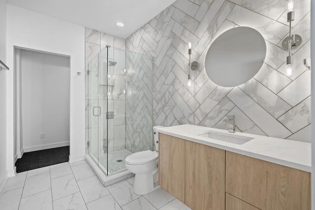 full bath featuring toilet, marble finish floor, tile walls, a shower stall, and vanity