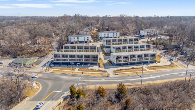 birds eye view of property with a wooded view