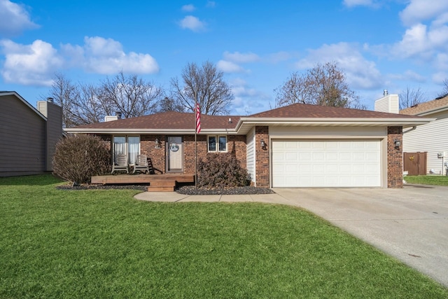 single story home featuring a front yard, driveway, an attached garage, a chimney, and brick siding