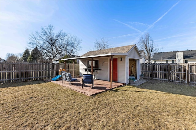 exterior space with an outdoor structure and a fenced backyard