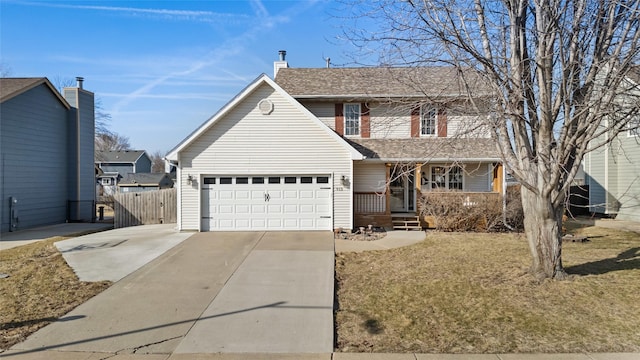 traditional-style house featuring fence, covered porch, concrete driveway, a shingled roof, and a garage