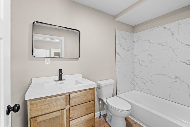 bathroom featuring baseboards, toilet, wood finished floors, vanity, and  shower combination