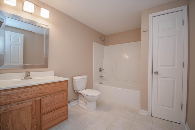 bathroom featuring toilet, vanity, tile patterned flooring, baseboards, and shower / bathtub combination