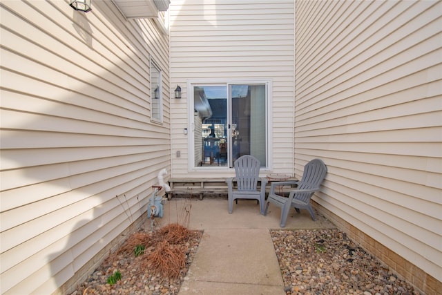 entrance to property with a patio area