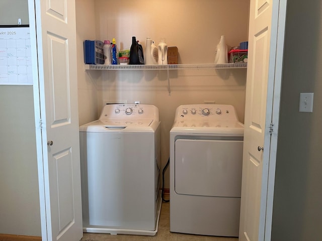 washroom with laundry area and independent washer and dryer