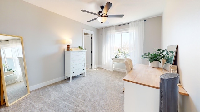 office area featuring baseboards, carpet, and ceiling fan