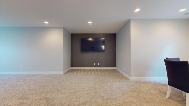 interior space with recessed lighting, baseboards, and light carpet