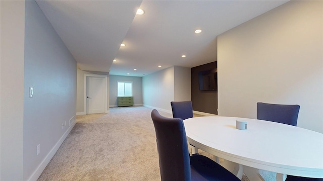 dining area with recessed lighting, baseboards, and light carpet