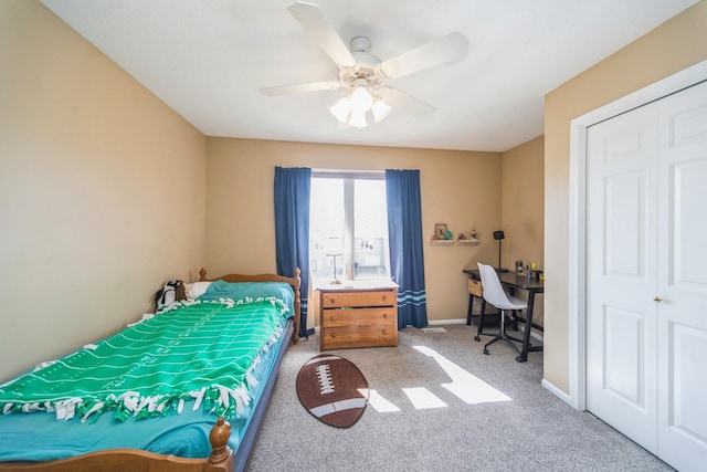 bedroom with baseboards, carpet floors, and ceiling fan