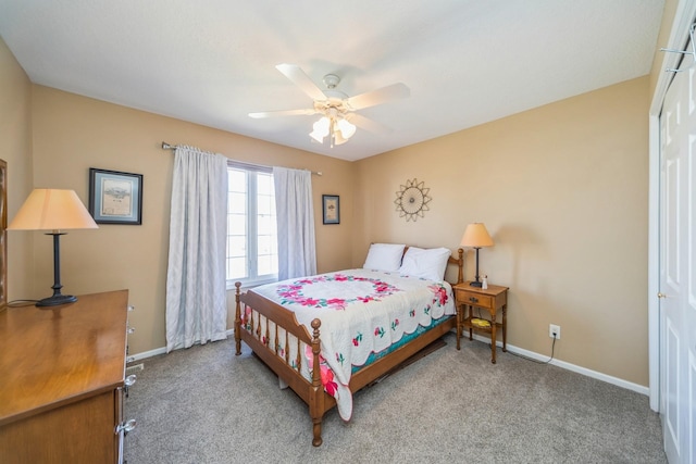 carpeted bedroom with baseboards and ceiling fan