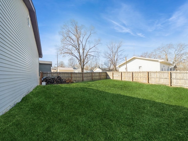 view of yard with a fenced backyard