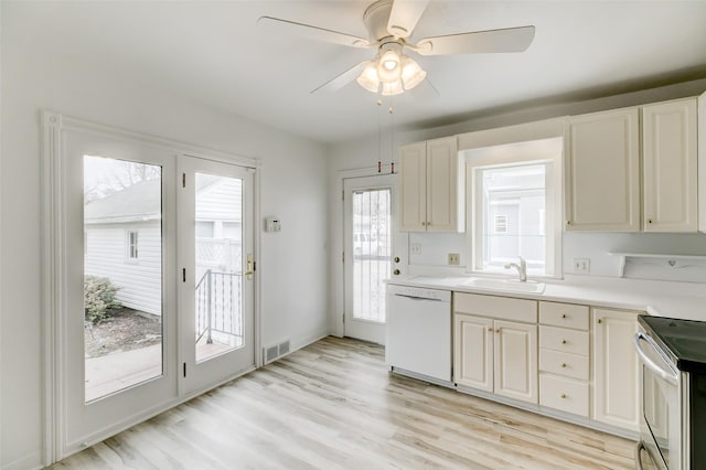 kitchen with visible vents, light wood-style flooring, a sink, stainless steel range with electric stovetop, and dishwasher