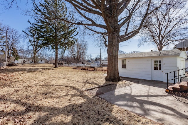 view of yard featuring a patio and fence