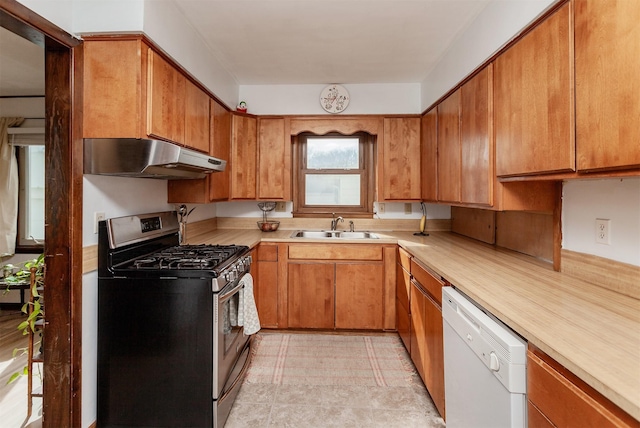 kitchen featuring under cabinet range hood, dishwasher, light countertops, stainless steel gas stove, and a sink