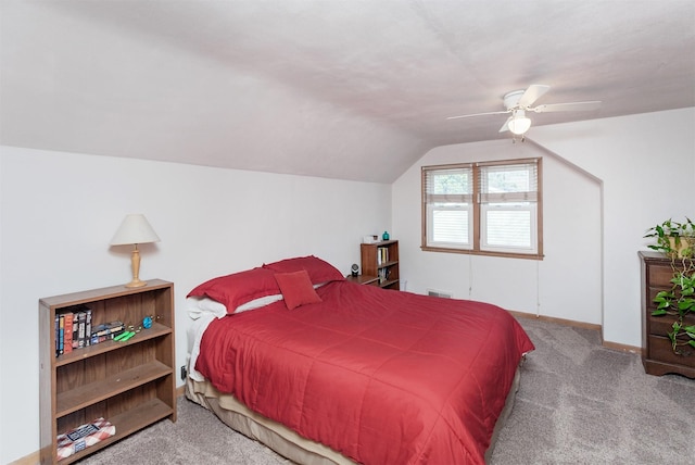 bedroom featuring vaulted ceiling, carpet flooring, a ceiling fan, and baseboards