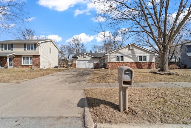 exterior space with brick siding and driveway