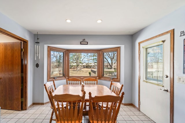 dining room featuring recessed lighting, baseboards, and light tile patterned flooring