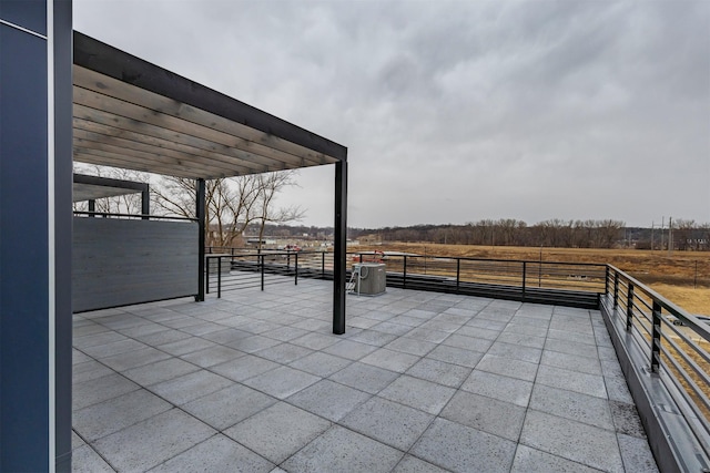 view of patio / terrace with a rural view