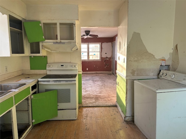 kitchen with green cabinetry, washer / dryer, electric stove, light wood-style floors, and under cabinet range hood