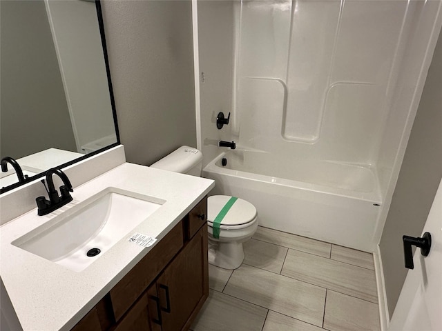 bathroom with vanity, toilet, and shower / bathtub combination