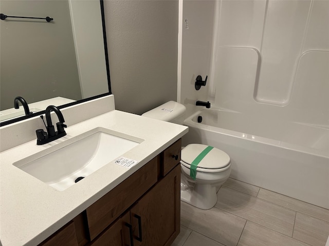 full bath with vanity, shower / bathing tub combination, and toilet